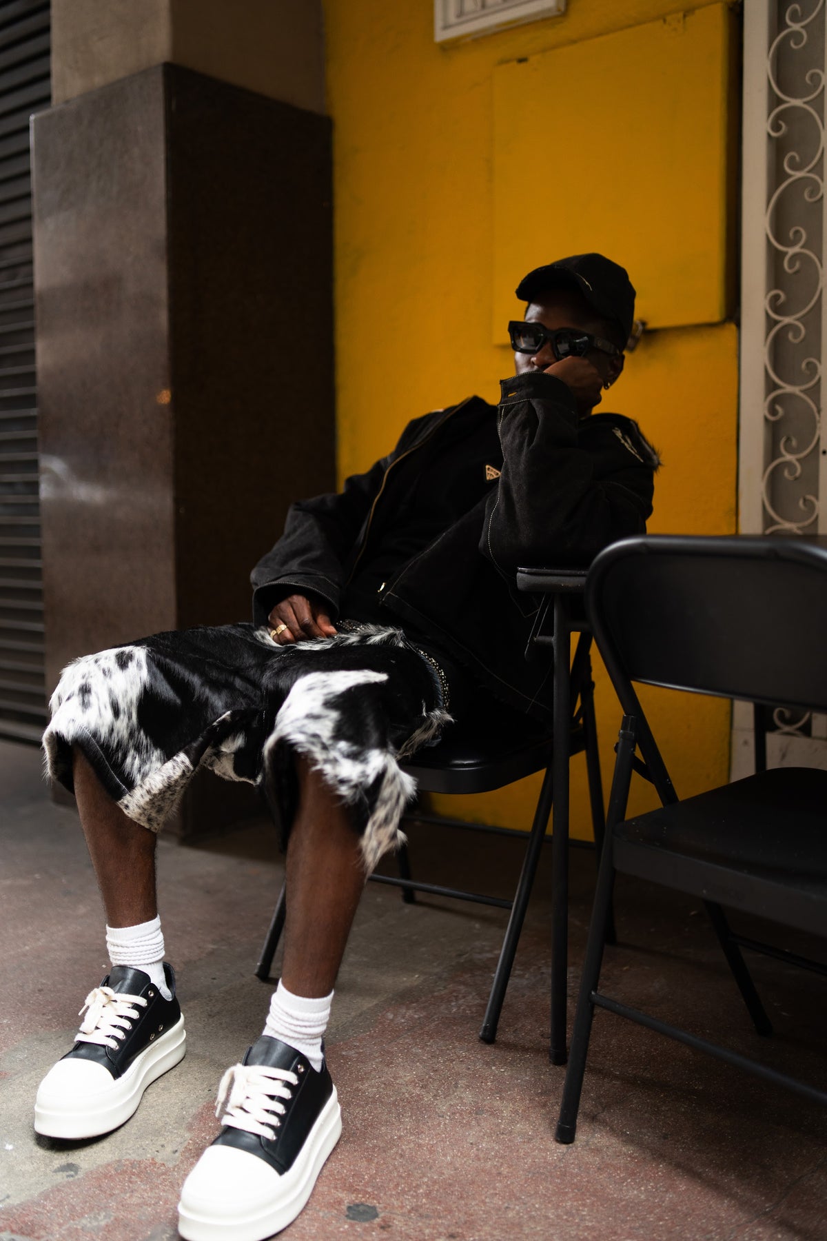 Cowhide Short — seated editorial